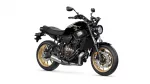 Black Yamaha motorcycle shown from a front-right angle with gold wheels on a white background, highlighting its sleek design.