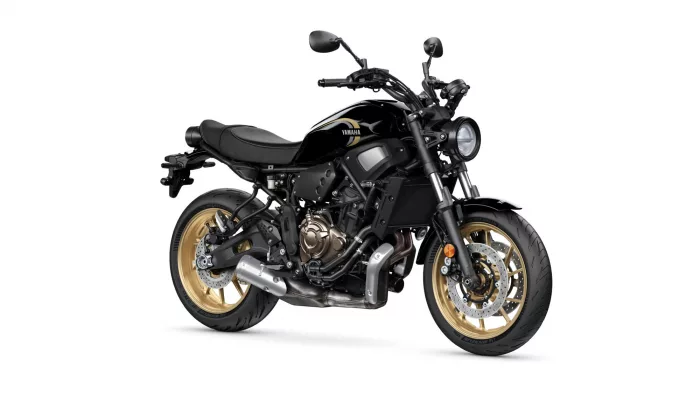 Black Yamaha motorcycle shown from a front-right angle with gold wheels on a white background, highlighting its sleek design.