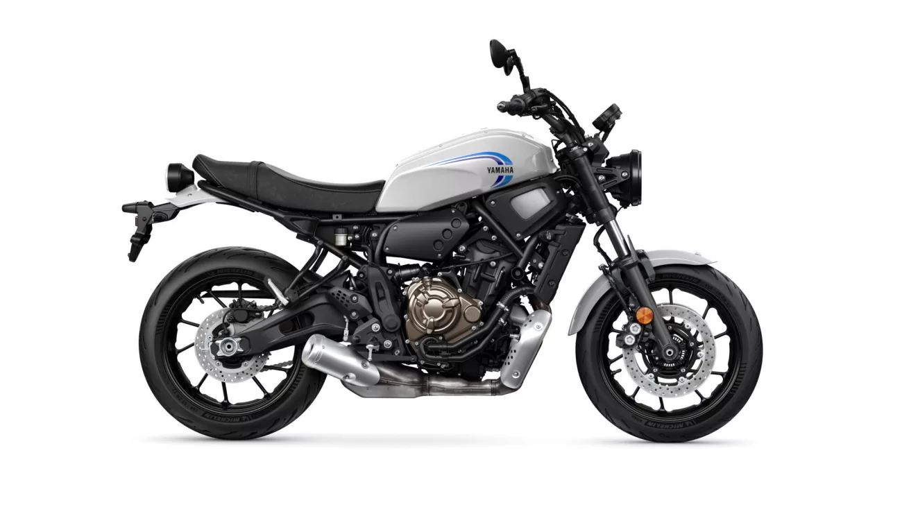 Side profile of a Yamaha motorcycle with a white fuel tank and blue logo, shown from the left side.