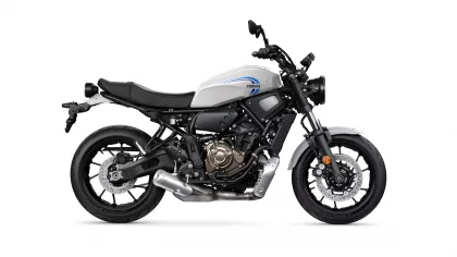 Side profile of a Yamaha motorcycle with a white fuel tank and blue logo, shown from the left side.