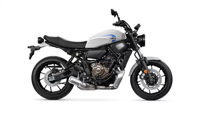 Side profile of a Yamaha motorcycle with a white fuel tank and blue logo, shown from the left side.