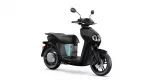 Black electric scooter shown in a right-side profile, with a teal accent panel and dual front lights on a white background.