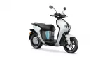 White and black scooter shown from a side angle with turquoise accent stripe on the body and large wheels.
