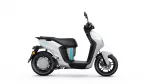 Side view of a silver and black Yamaha scooter with a blue accent stripe and black seat, shown from the left side