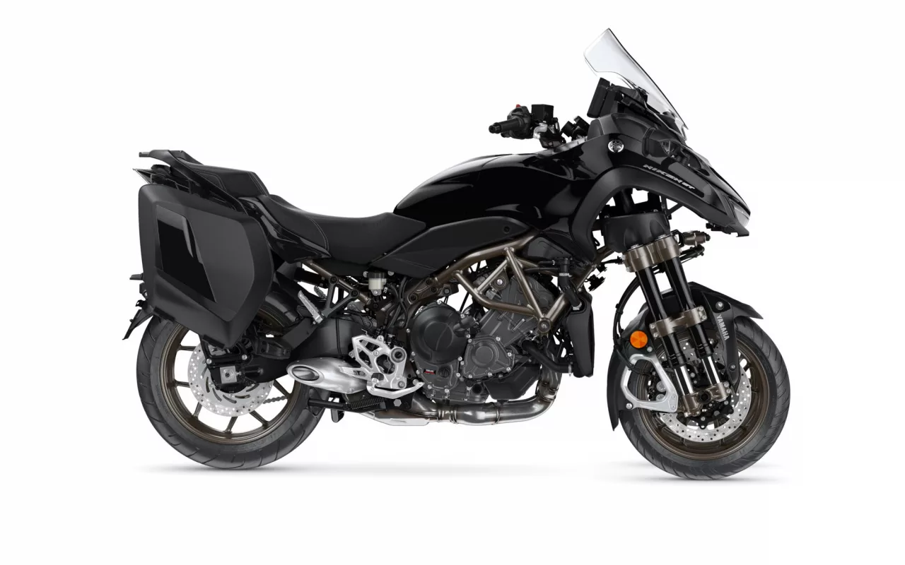 Black Yamaha Niken sport-touring motorcycle with side panniers, isolated on white; front dual-wheel setup visible and glossy black bodywork