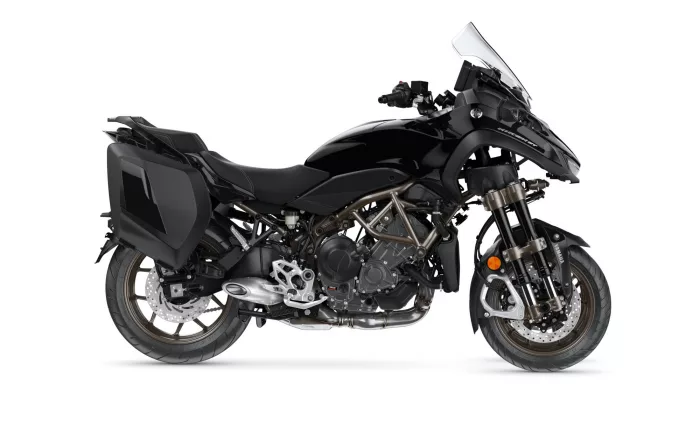 Black Yamaha Niken sport-touring motorcycle with side panniers, isolated on white; front dual-wheel setup visible and glossy black bodywork