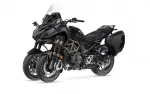 Black adventure/sport-touring motorcycle with large windscreen and hard side panniers on a white background