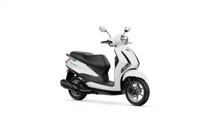 White scooter shown from a front-right angle with black seat and chrome mirrors against a white background