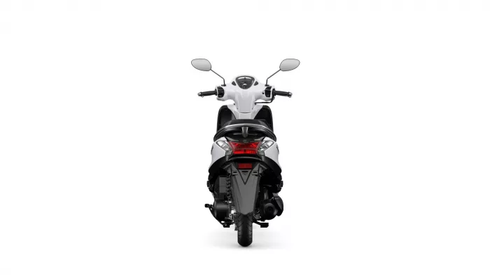 Rear view of a white scooter from behind, showing the seat, taillights, and handlebars.