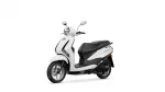 White scooter photographed from a front-left angle, showcasing its headlight and mirrors against a white background.