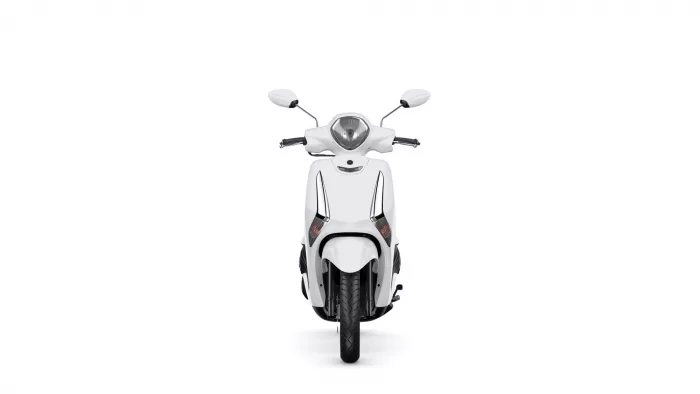 Front view of a white scooter facing the camera, showing headlight, mirrors, and front fender