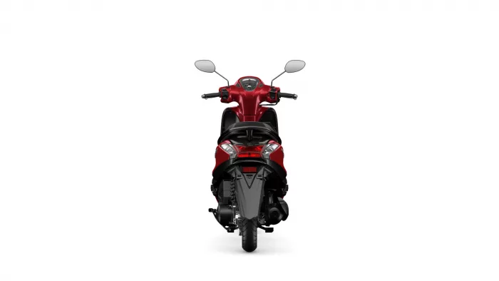 Rear-view of a red scooter with tail lights and seat against a white background