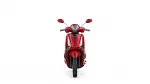 Front view of a red scooter facing the camera, headlight centered and mirrors extended