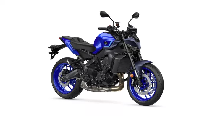 Blue sport motorcycle shown from a left-front side angle, exposing the engine and blue rims