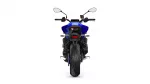 Rear view of a blue sport motorcycle, showing the wide rear tire, taillight, and handlebar mirrors.