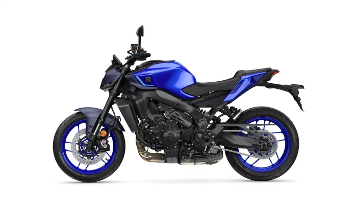 Blue Yamaha sport motorcycle shown from the left side, exposing engine, frame, and blue rims against a white background.