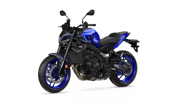 Blue sport motorcycle with black frame and blue accents, shown from a front-side angle with disc brakes visible on the front wheel and blue rims.