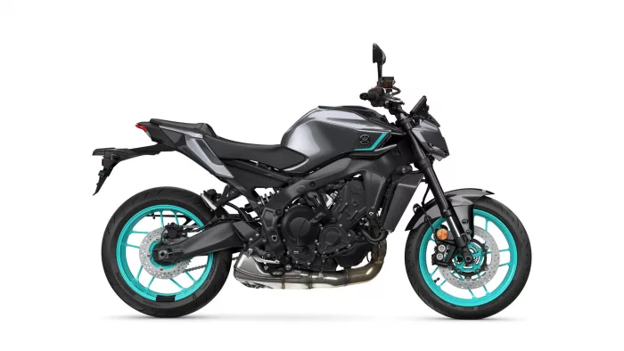 Modern sport motorcycle in grey/black with teal rims, side view
