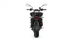 Rear view of a black sport motorcycle with a wide tire, taillight, and mirrors on a white background.