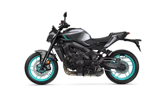 Sport motorcycle in metallic gray with teal accents and turquoise wheels, shown from the left side.