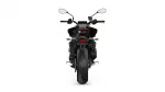 Rear view of a black motorcycle showing the single wide rear tire, taillight, and dual mirrors above handlebars