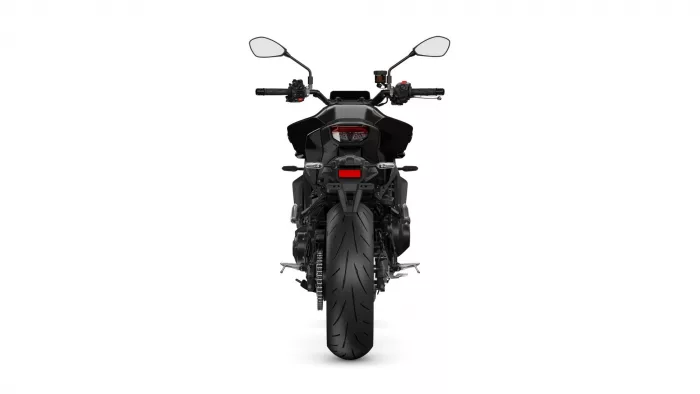 Rear view of a black motorcycle showing the single wide rear tire, taillight, and dual mirrors above handlebars