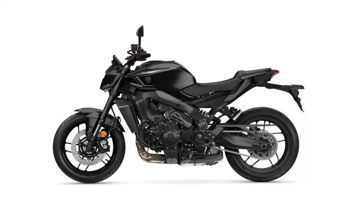 Black sport motorcycle shown in a side profile with visible engine, black bodywork, and disc brakes