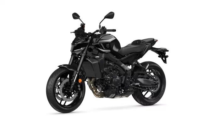 Black sport motorcycle shown from the left side with angular fairings and exposed engine components, Yamaha branding visible on the tank.