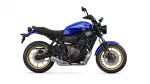 Blue Yamaha street motorcycle shown in side view with gold wheels and black frame