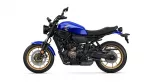 Side profile of a blue Yamaha sport motorcycle with gold wheels on a white background, showing the engine and frame details