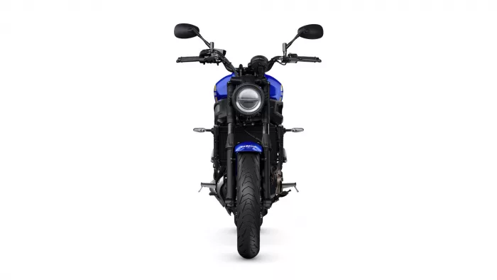 Front view of a blue Yamaha motorcycle against a white background, facing the viewer with a round headlight.