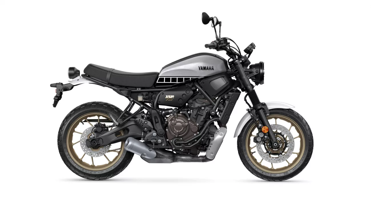 Side view of a Yamaha XSR 700 motorcycle with a silver fuel tank and black frame, shown in profile on a white background.