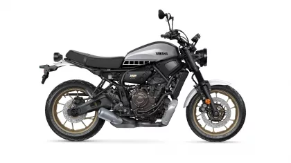 Side view of a Yamaha XSR 700 motorcycle with a silver fuel tank and black frame, shown in profile on a white background.
