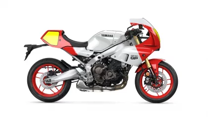 Side view of a Yamaha XSR900 GP sport motorcycle in white with red accents and red wheels on a white background with a prominent yellow-tinted windscreen area.