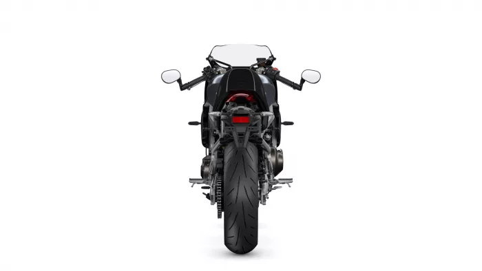 Rear view of a black sport motorcycle on a white background, showing taillight, mirrors, and wide rear tire