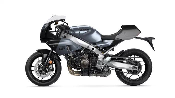 Side profile of a gray Yamaha sport motorcycle (XSR900 GP), showing the exposed engine, silver frame, and rear swingarm.