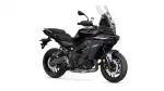 Black Yamaha Tracer sport-touring motorcycle viewed from the front-right with a tall windshield and exposed engine.