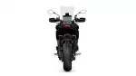 Rear view of a black motorcycle with a tall windscreen, side mirrors, and taillight seen from behind