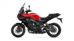 Red and black Yamaha sport motorcycle shown in side profile with windshield