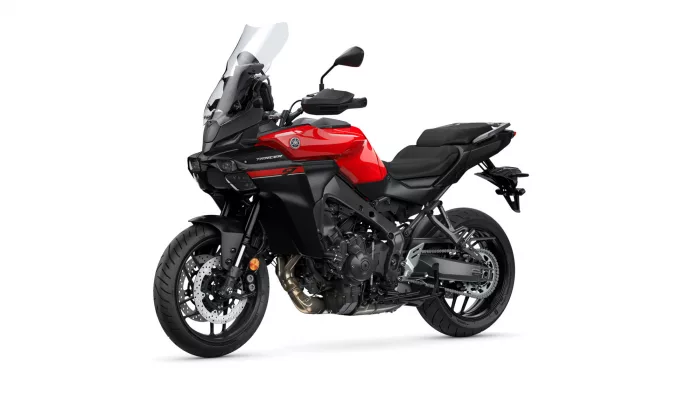 Red and black Yamaha Tracer sport-touring motorcycle shown in a side-front perspective, highlighting the windscreen and front wheel.