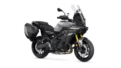 Gray Yamaha Tracer 9 GT sport-touring motorcycle with black side cases and a tall windshield