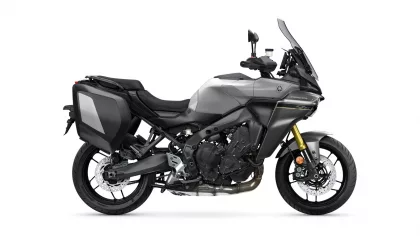 Grey Yamaha Tracer sport-touring motorcycle with side panniers and tall windshield on a white background.