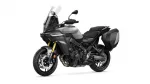 Yamaha adventure motorcycle in gray with a tall windscreen and large black side panniers.