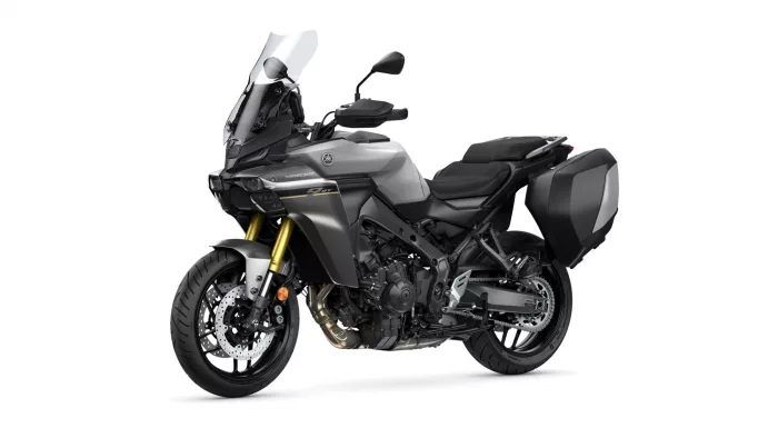 Yamaha adventure motorcycle in gray with a tall windscreen and large black side panniers.