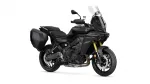 Black Yamaha Tracer 9 GT sport-touring motorcycle with integrated side panniers and a tall windscreen