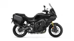 Side view of a black Yamaha Tracer GT adventure motorcycle with hard saddlebags and a tall windshield