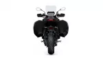 Rear view of a black adventure motorcycle with large side panniers and a tall windscreen