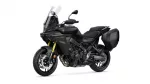 Black Yamaha motorcycle with windshield and side panniers, shown from a front-side angle showcasing the bike's fairing and dual-disc front brakes.