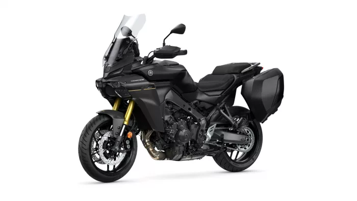 Black Yamaha motorcycle with windshield and side panniers, shown from a front-side angle showcasing the bike's fairing and dual-disc front brakes.