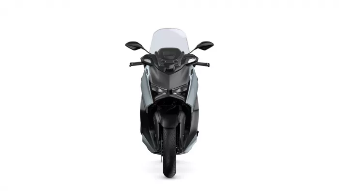 Front view of a modern sport motorcycle with a tall windshield and side mirrors.